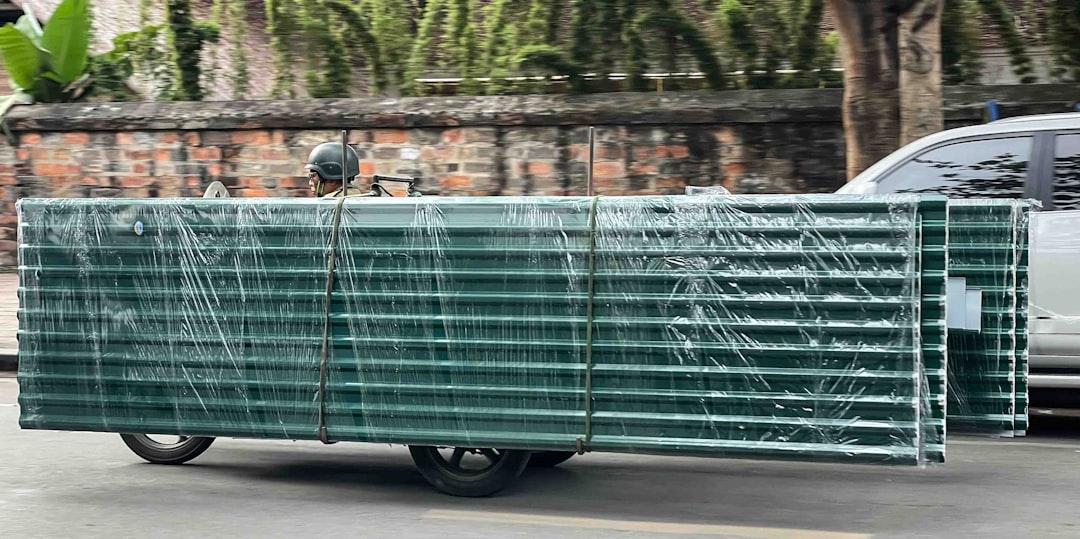 green-metal-panels-stacked-on-a-cart-ppakcb9anay